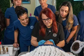 Students practicing advanced aesthetic treatments during weekly on-campus classes at FAMA