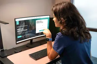 Student studying online aesthetician curriculum and theory coursework via distance learning