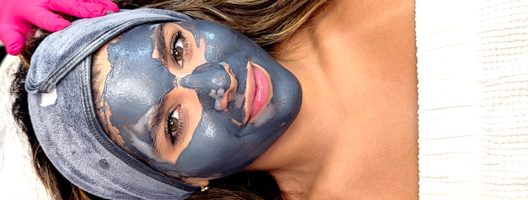 FAMA student performing a skincare treatment